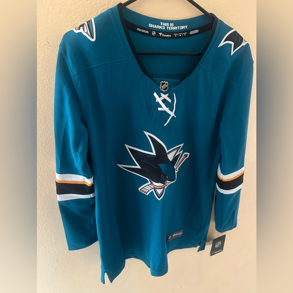 Brand new- never worn women’s Sharks jersey